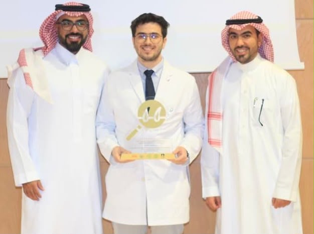 Dr. Asem receiving the Best Doctor award