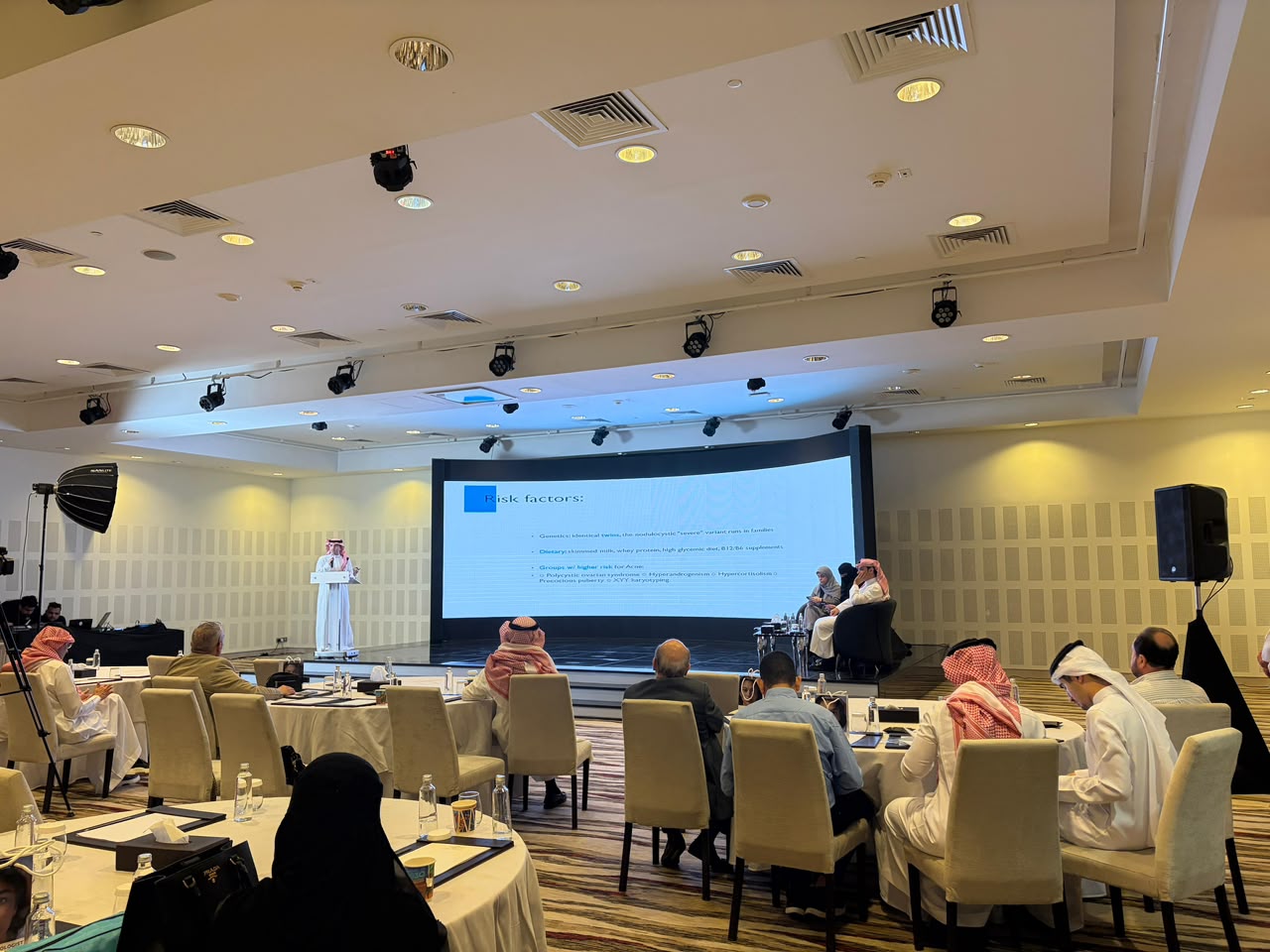 Dr. Asem lecturing at a medical symposium